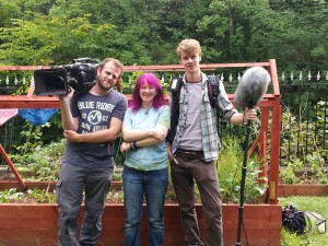 Debbie Tomkies poses with the film crew at Leeds Industrial Museum (Armley Mills) for the filming of Glorious Gardens from Above which featured the Heritage Dye Project and Hyde Park Source dye garden at the Mill